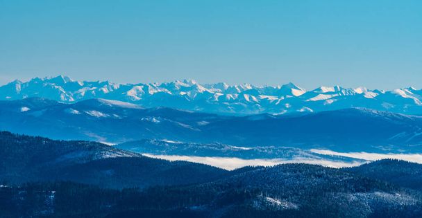 Amazing view to High Tatras and easternmost part of Western Tatras from Lysa hora hill in winter Moravskoslezske Beskydy mountains in Czech republic - Foto, Bild