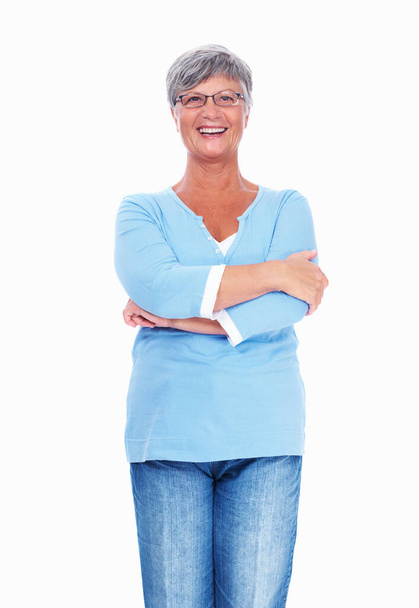 Happy mature woman smiling over white background with hands folded. - Foto, immagini