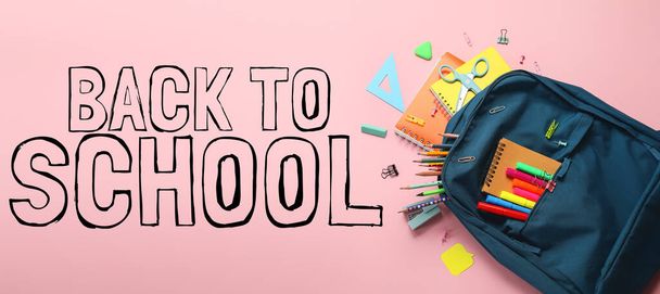 Backpack with stationery and text BACK TO SCHOOL on pink background - Fotó, kép