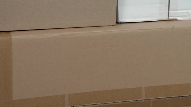 Used cardboard boxes for parcel delivery close-up - Πλάνα, βίντεο