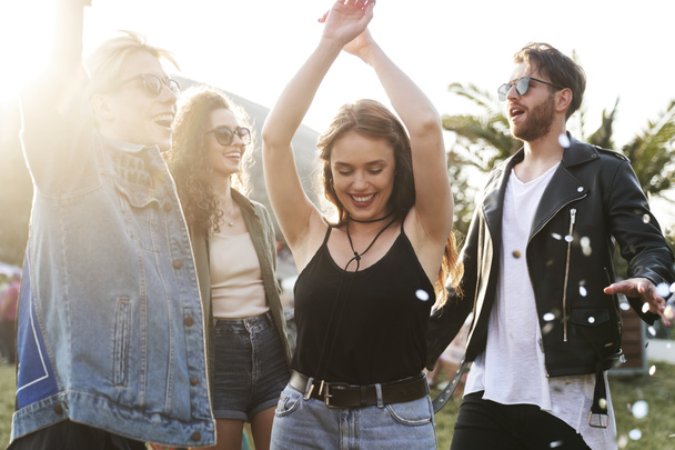 Group of young caucasian friends dancing and  having fun on music festival - Photo, Image