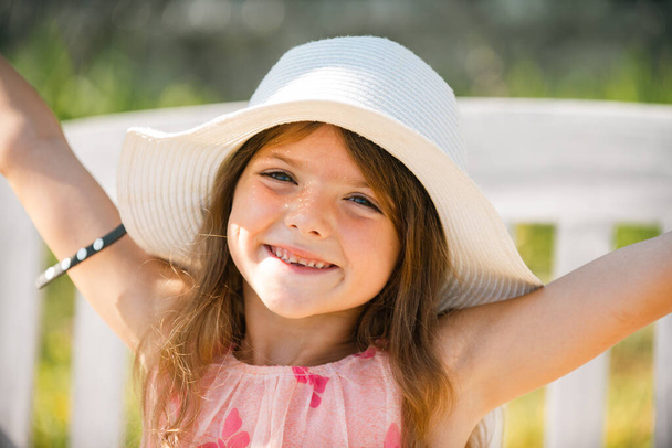 Happy child face. Child teen girl has summer joy. Happy day. Cute playful cheerful kid with funny face. Emotional portrait of a cheerful and positive smiling teen girl - Photo, image