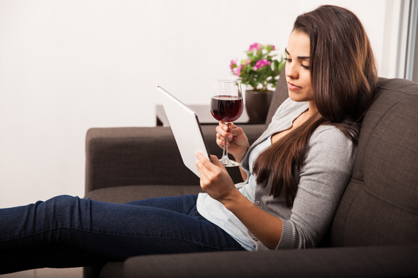 Woman with tablet and wine glass - Φωτογραφία, εικόνα