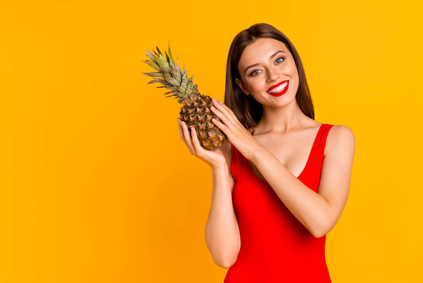 Portrait of positive stunning charming lady recommend organic tasty ananas ripe isolated shine color background. - Фото, зображення
