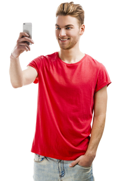 Young man taking a selfie - 写真・画像