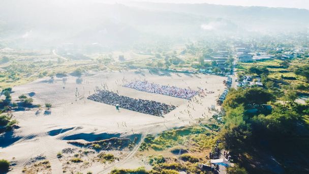 Aerial View People around Parangkusumo sand dunes are praying Eid al-Fitr in the morning - 写真・画像