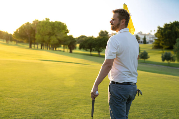 Side view of a professional golf player at golf club. - Photo, Image