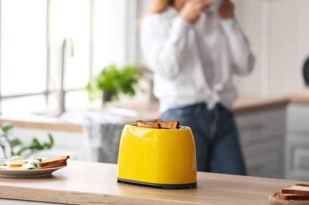 Modern toaster on kitchen table - Foto, Imagem