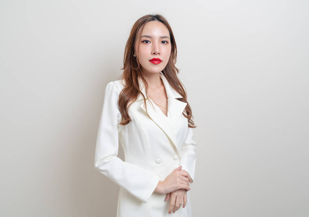 portrait beautiful Asian business woman in white dress suit - Fotó, kép