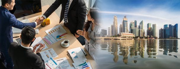 Group business people handshake at meeting table in widen view in office together with confident shot from top view . Young businessman and businesswoman workers express agreement of investment deal. - Фото, изображение