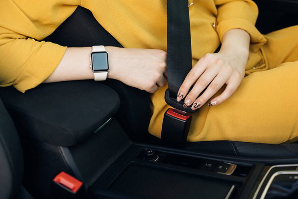 Buckle up seat belt in a car. Woman Hand Fastening Car Safety Seat Belt. Protection Road Safety Snap. Driver Fastening Seatbelt In Car. Woman Car Lap Buckling Inside Vehicle Before Driving. - Фото, зображення
