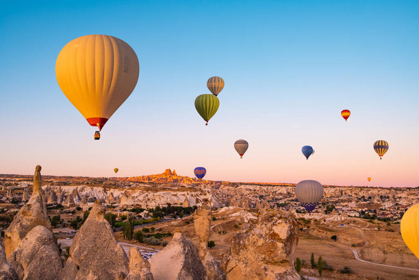 Hot air balloons making bright sky in Cappadocia, Turkey - Фото, изображение