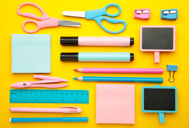 School supplies on yellow background. Top view. - Photo, Image