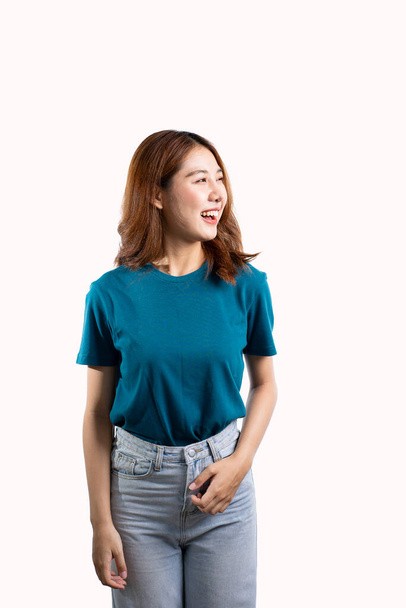 Cute and charming smiling Asian woman gesturing hands on white background. - Zdjęcie, obraz