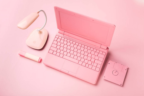 Colored pinColored pink laptop with bright floppy disk, modernity concept.k laptop with bright floppy disk, modernity concept. High quality photo - 写真・画像