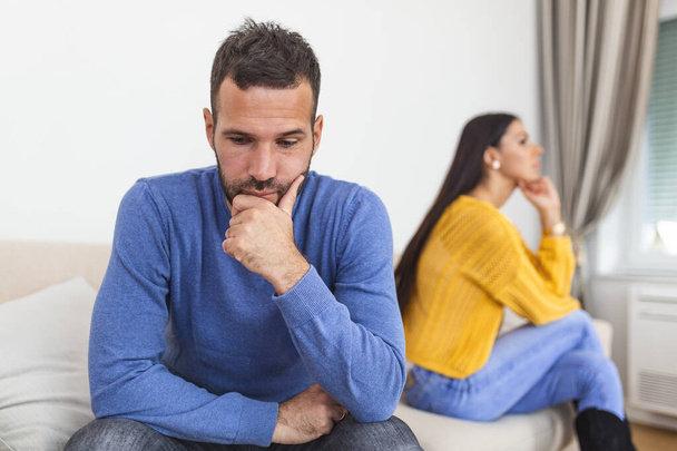 People, relationship difficulties, conflict and family concept - Unhappy couple having argument at home. Couple Having Argument At Home. Troubled woman expressing despair - Φωτογραφία, εικόνα