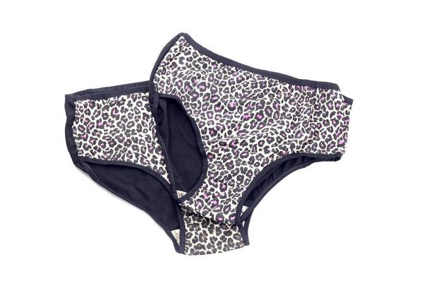 Female, new, modern panties black color with pattern on a white background close-up - Фото, зображення