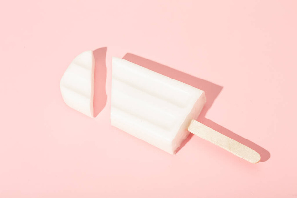 Vanilla ice cream on a stick on a pink background. Vector illustration. High quality photo - Valokuva, kuva