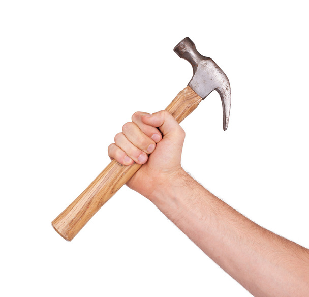 La mano del hombre sosteniendo el martillo
 - Foto, imagen