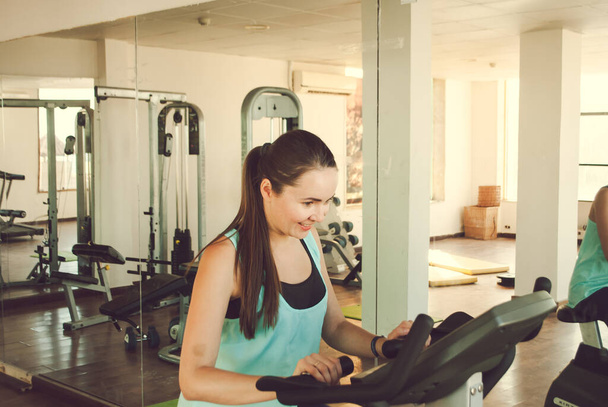 young woman training in the gym. High quality photo - Photo, image
