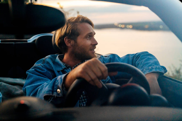 White bearded man smiling while driving in car during trip - Foto, Imagem