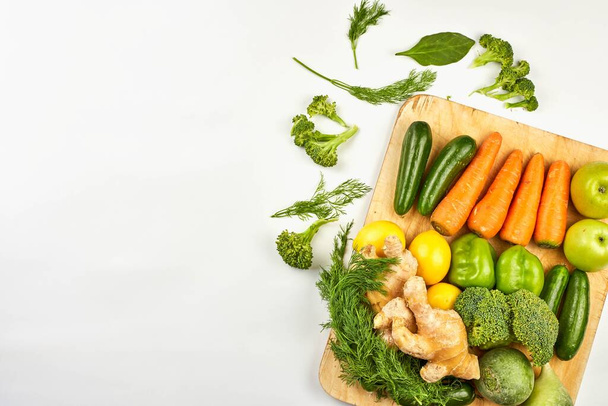 Overhead view of fresh raw fruits and vegetables - Фото, зображення