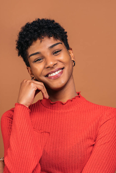 Stock photo of beautiful black woman smiling and having fun in studio shot. - Fotó, kép
