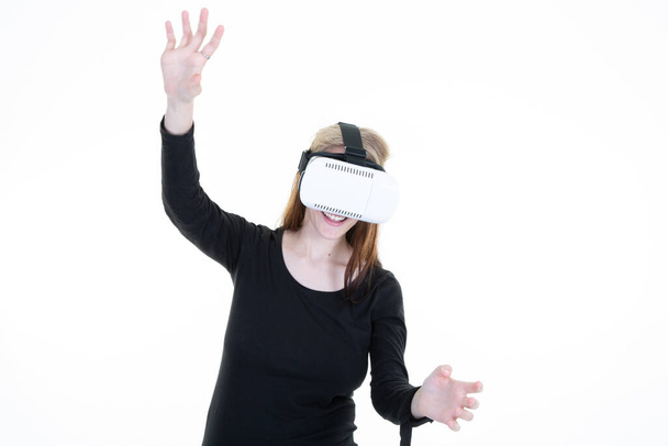 blonde woman trying virtual reality glasses vr over white background - Φωτογραφία, εικόνα