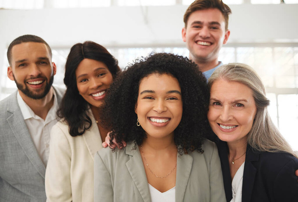 Portrait of a group of happy diverse businesspeople standing together in an office. Confident team of five business professionals at work. - Foto, Imagem