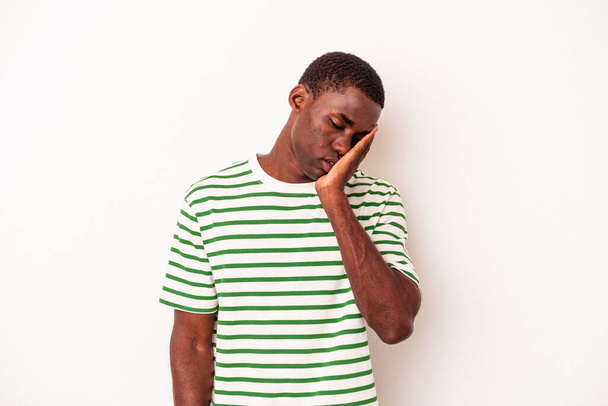 Young African American man isolated on white background who is bored, fatigued and need a relax day. - Photo, Image