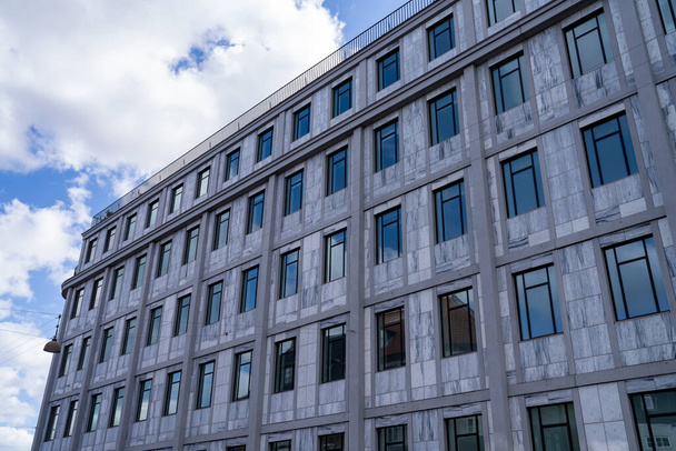 Reflecting Window Glass on Symmetric Modern building brick facade in Downtown of Copenhagen, Denmark, Scandinavia. - 写真・画像