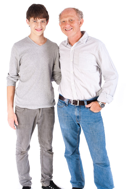 Teenager and grandfather, in studio - 写真・画像