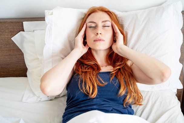 One woman suffering insomnia disturbed by noise - Zdjęcie, obraz
