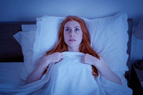 One woman suffering insomnia disturbed by noise - 写真・画像