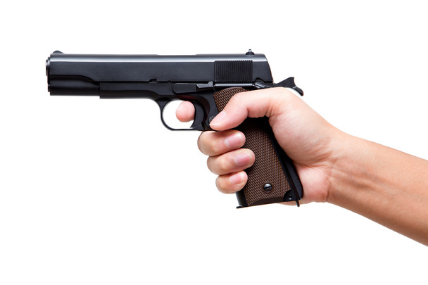 Mão segurando pistola, dedo no gatilho, 11 mm
 - Foto, Imagem