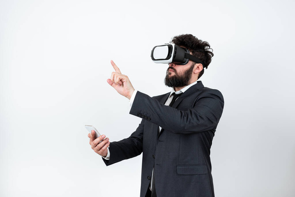 Man Wearing Vr Glasses And Pointing On Important Messages With One Finger. - Foto, afbeelding