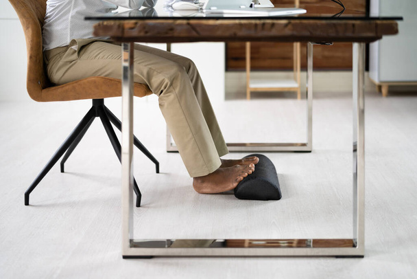 Footrest Against Pain In Office. Shifting Posture And Positions - Photo, Image