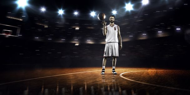 Basketball player is spinning ball around the finger - Fotoğraf, Görsel