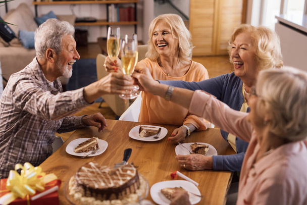 Happy senior people having fun while celebrating Birthday and toasting with Champagne. - Fotoğraf, Görsel