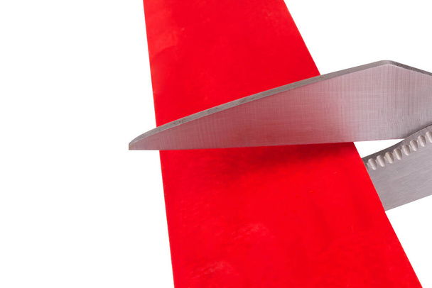 scissors cut isolated on white background red ribbon paper. - Foto, afbeelding