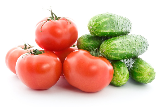 Fresh raw tomatoes and cucumbers. - Фото, изображение