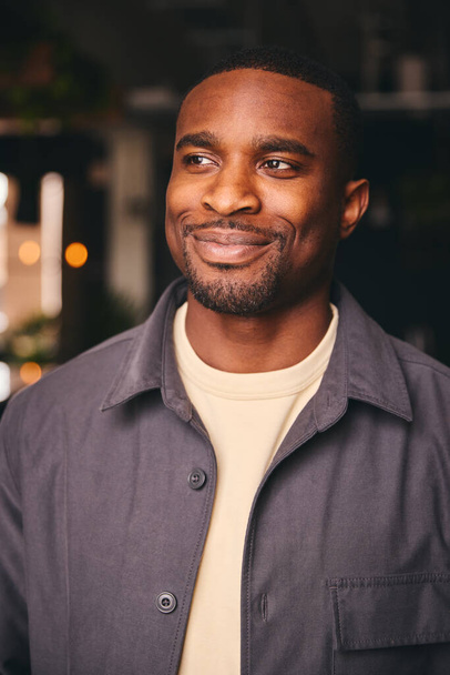 Smiling Young Black Male Standing In Office Looking At Camera - Foto, afbeelding