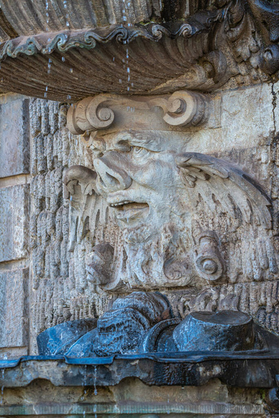 Ancient sculpture of funny, tricky and joyful dickens at fountains in historical downtown of Dresden, Germany, details, closeup. Concept of art and historical heritage - Foto, Imagen
