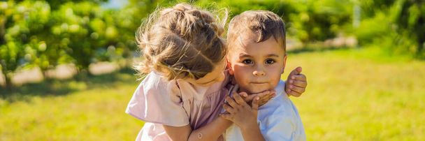 BANNER, LONG FORMAT Portrait of two cute adorable baby children toddlers hugging and kissing each other, love friendship in childhood concept, best friends forever. - Fotoğraf, Görsel