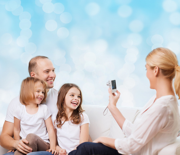 happy family with camera at home - Foto, imagen