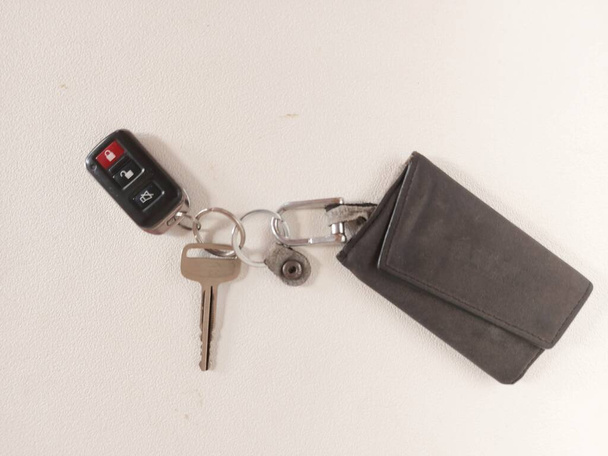 karawang,indonesia-july 19 2022: key chain of car key and car alarm and security system remote. completed with leather wallet - Photo, Image