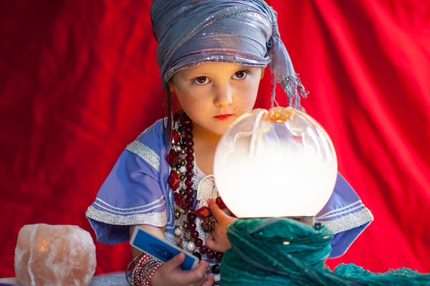 little child plays to be a fortune teller - Photo, Image
