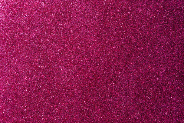 Background with sparkles. Backdrop with glitter. Shiny textured surface. Dark pink. Mixed neon light - Fotografie, Obrázek