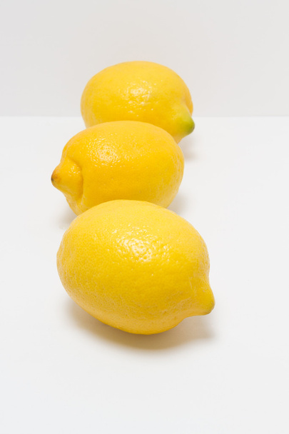 Whole lemons on a white background - Valokuva, kuva