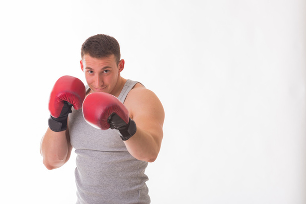 赤いボクシング グローブの強い男 - 写真・画像